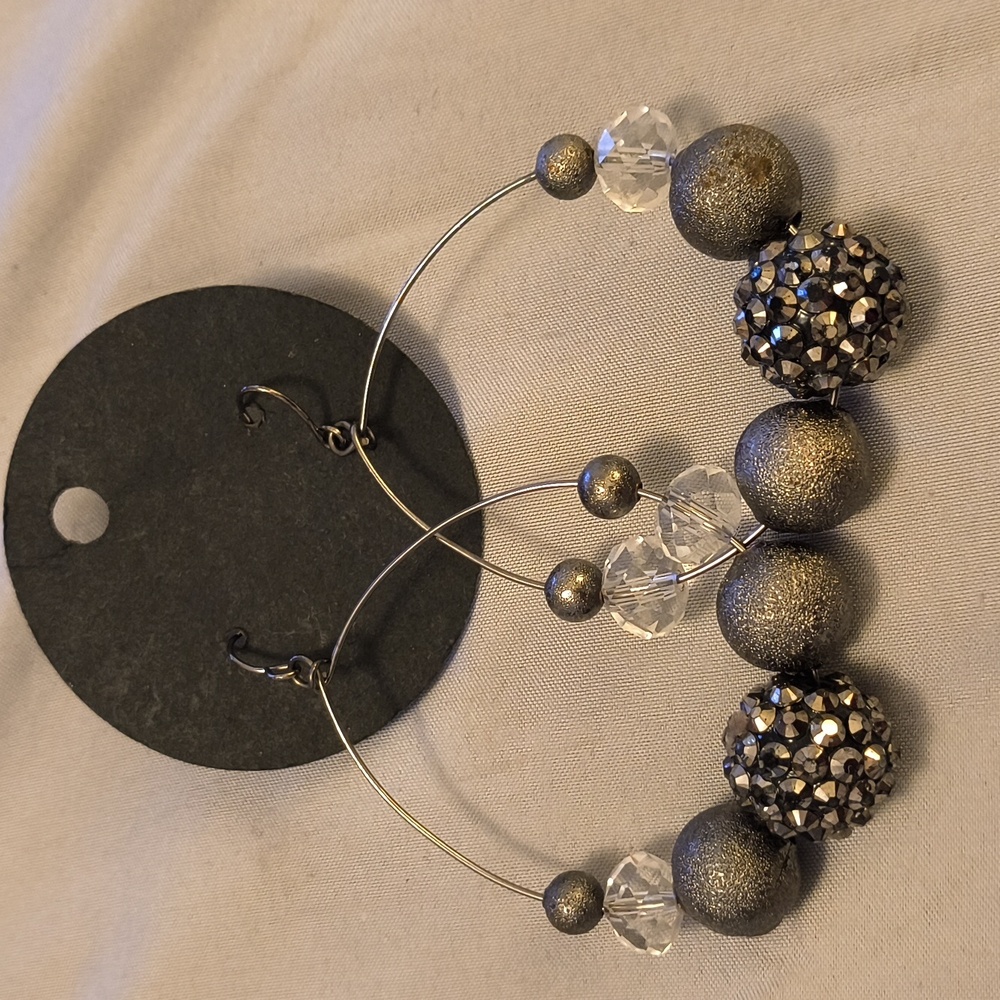 Hand made dangle hoops. Gun metal color and beaded.